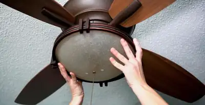Ceiling fan repair and reinstallation on ceiling mount in Charlotte, NC