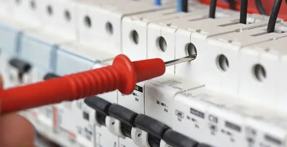 Electrical contractor testing circuit breakers during electrical repair in Fort Mill, SC