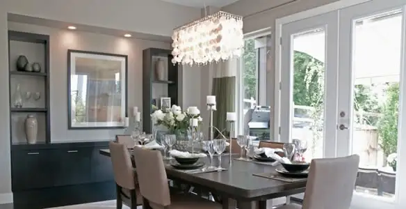 Elegant dining room chandelier installation above table in Charlotte, NC