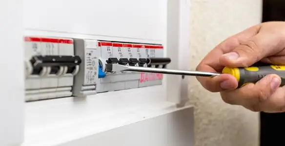 electrical panel upgrade service showing technician adjusting circuit breakers during system upgrade in Charlotte, NC