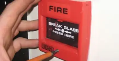 fire alarm installation service showing manual fire alarm pull station installed by licensed electricians in Charlotte, NC