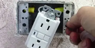 gfci circuits service showing installation of a ground fault circuit interrupter outlet by licensed electricians in Charlotte, NC