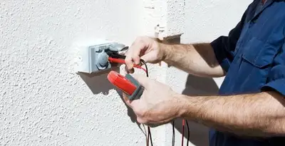 Electrician performing home electrical outlet and wiring inspection in Charlotte, NC