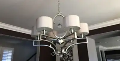 Modern chandelier installation with multiple light fixtures in Charlotte, NC