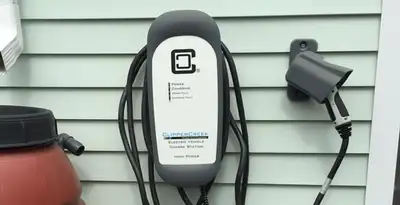 Outdoor electric vehicle charger installation on residential wall in Charlotte, NC