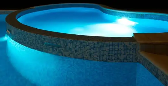 pool light installation and repair services highlighting illuminated pool interior lighting in Charlotte, NC