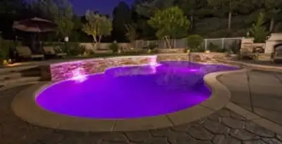 pool light installation and repair services illuminating a residential swimming pool in Charlotte, NC