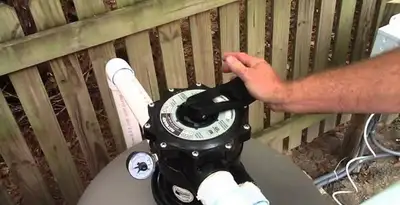 pool pumps service showing professional adjustment of pool pump control system in Charlotte, NC