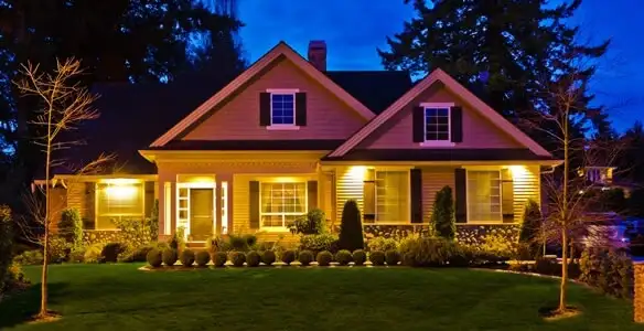 security light installation services illuminating a residential exterior at night in Charlotte, NC