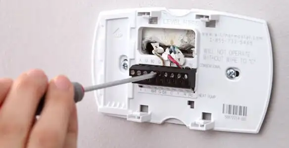 Thermostat installation service with proper wiring and secure wall mounting in Charlotte, NC