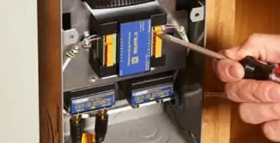 Whole home surge protection device being installed by a licensed electrician to protect electrical systems in Charlotte, NC